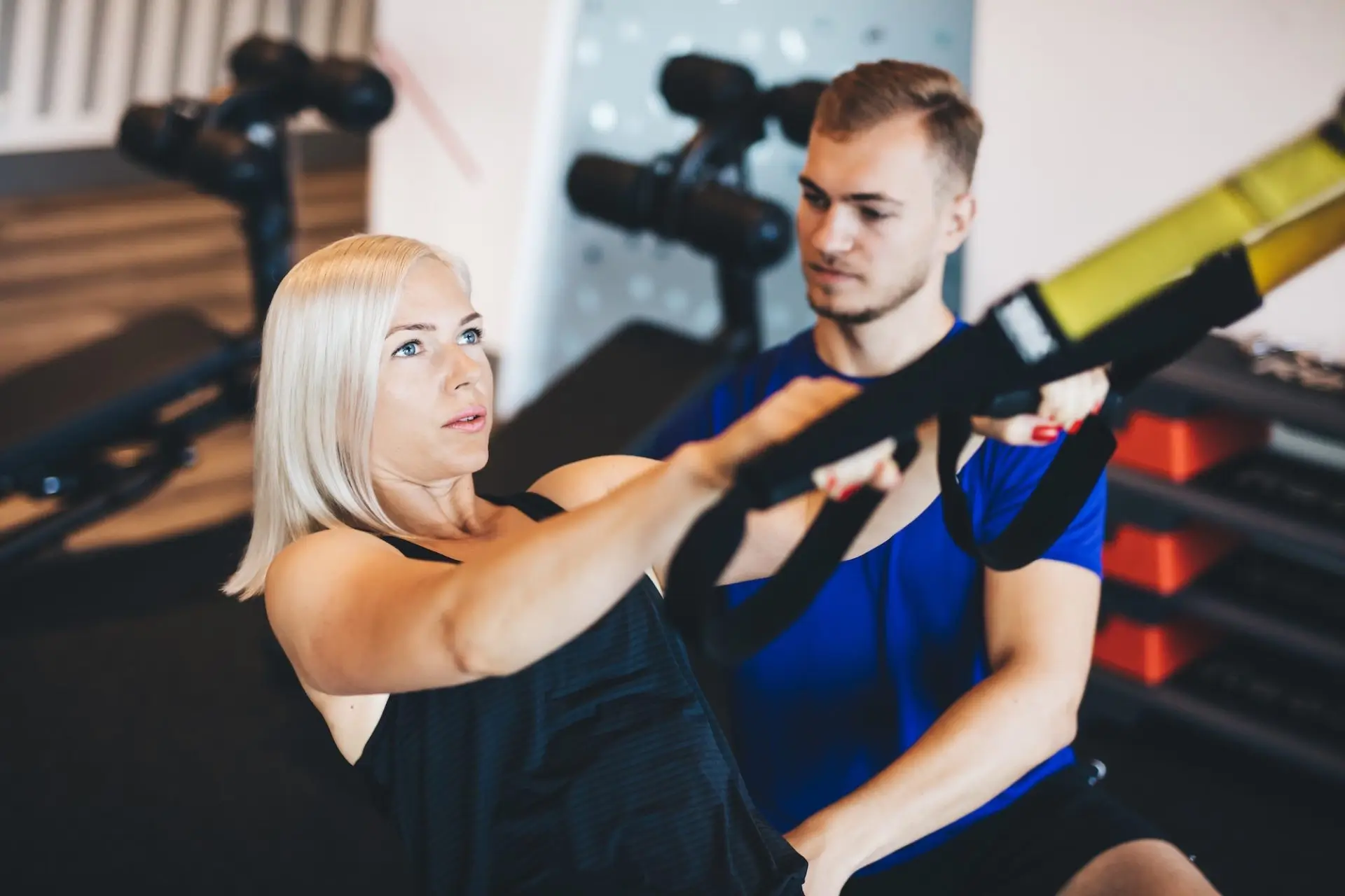 young-woman-exercising-with-personal-trainer-e1677564420850-19